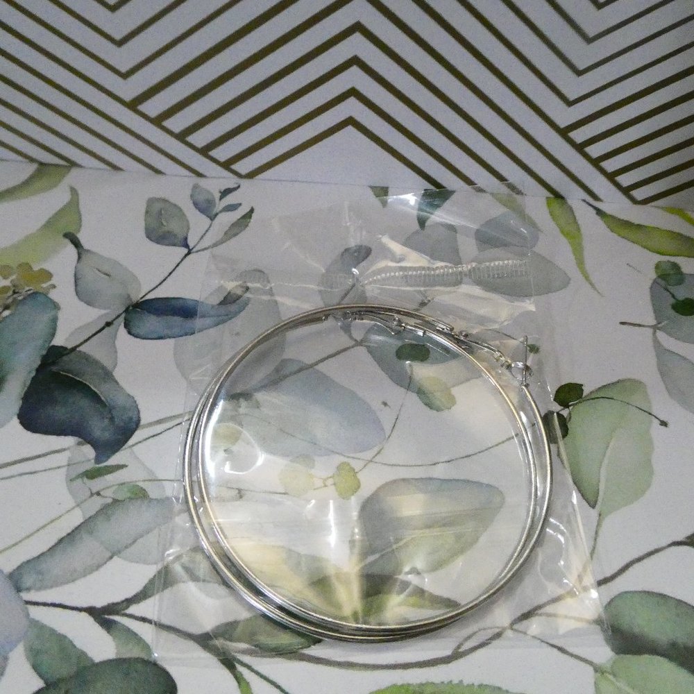 Large sized hoops. Silver. Brand new never has been warren. XXL